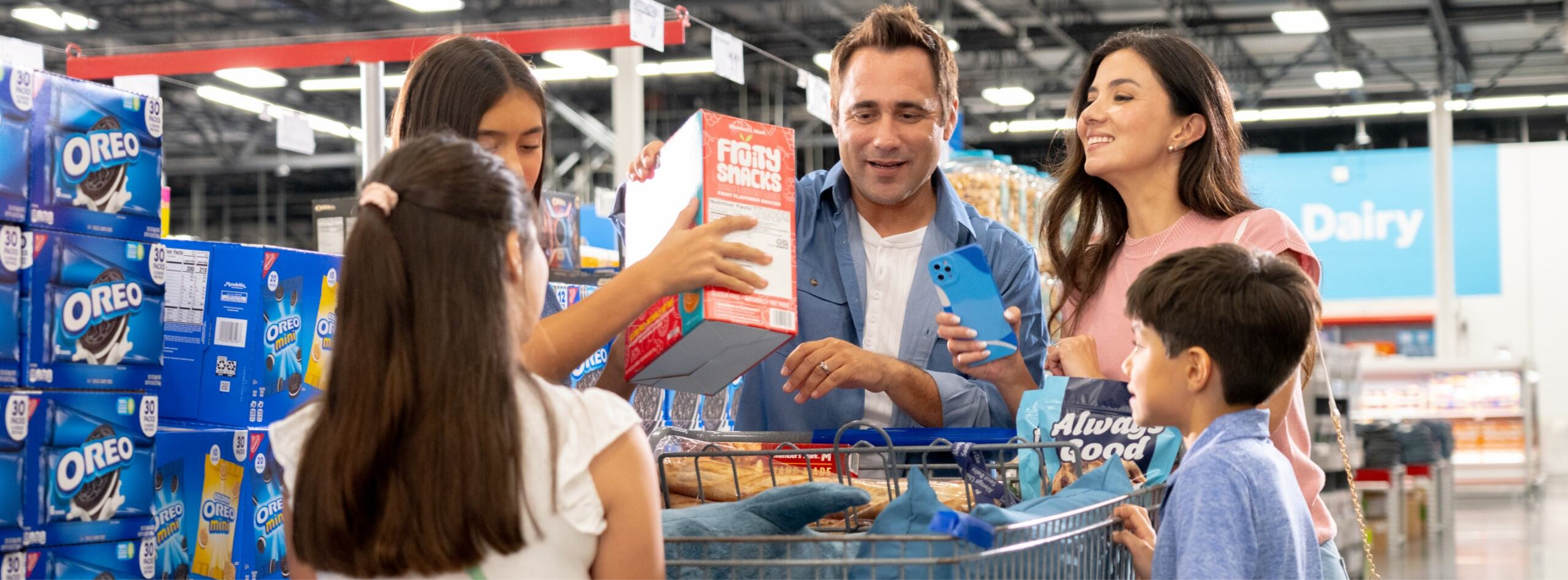 A family enjoys shopping together inside a Sam's Club.